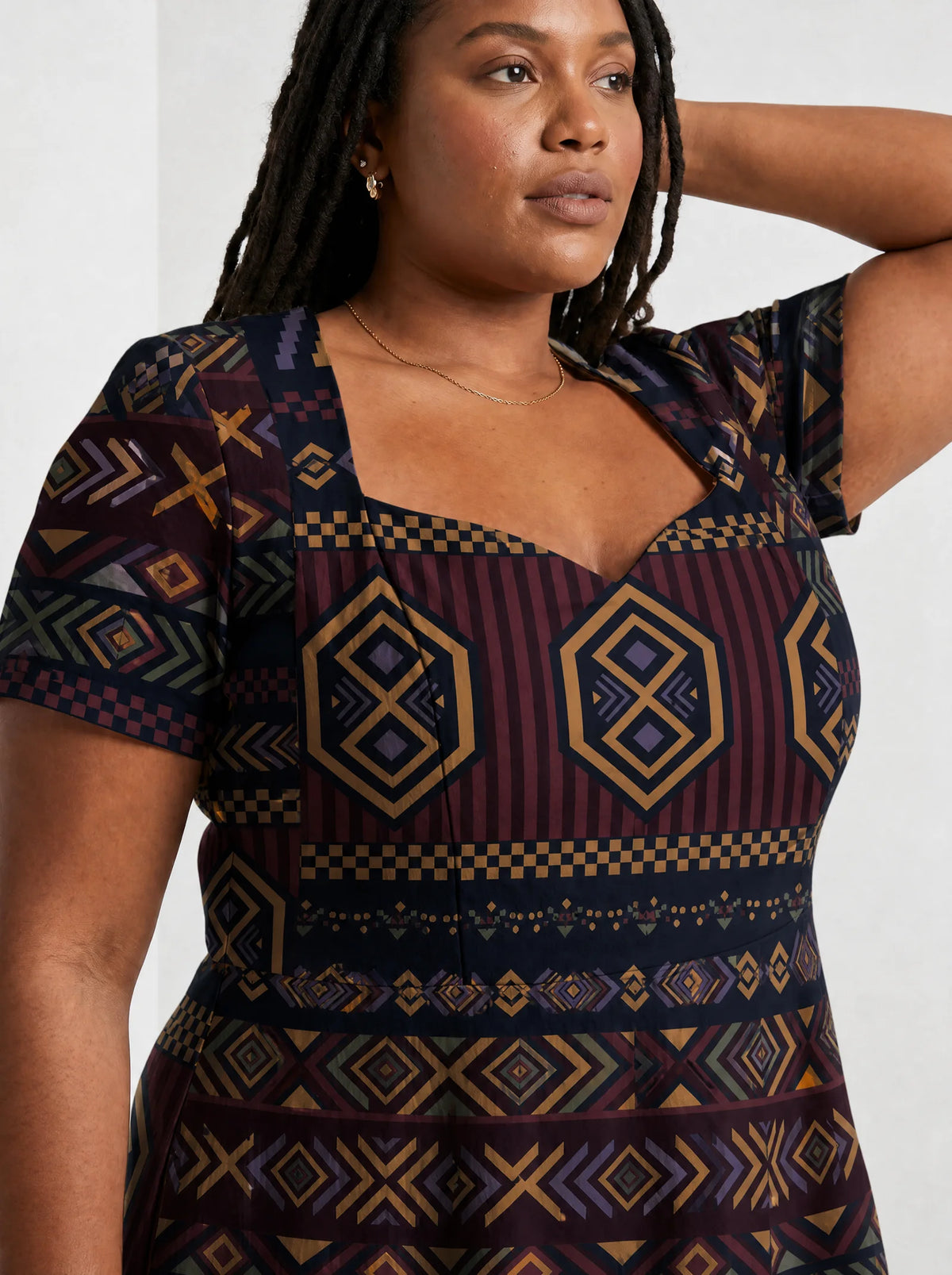 "Msuko" Sweetheart Midi Dress — close-up of the sweetheart neckline and short sleeve
