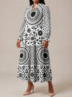 "Mwanga" Long Puff Sleeve Dress — three-quarter view on model