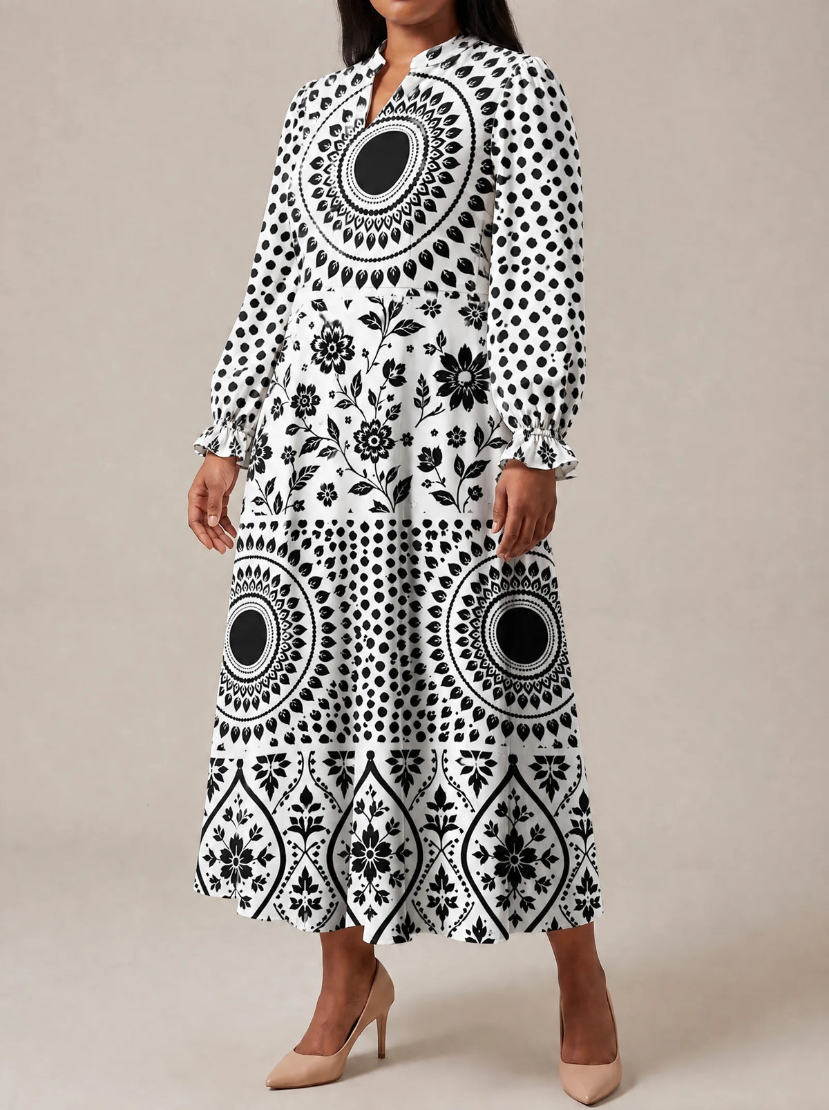"Mwanga" Long Puff Sleeve Dress — three-quarter view on model