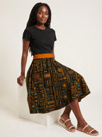 "Afrocentric Pattern" Twirl Skirt — seated on a studio cube