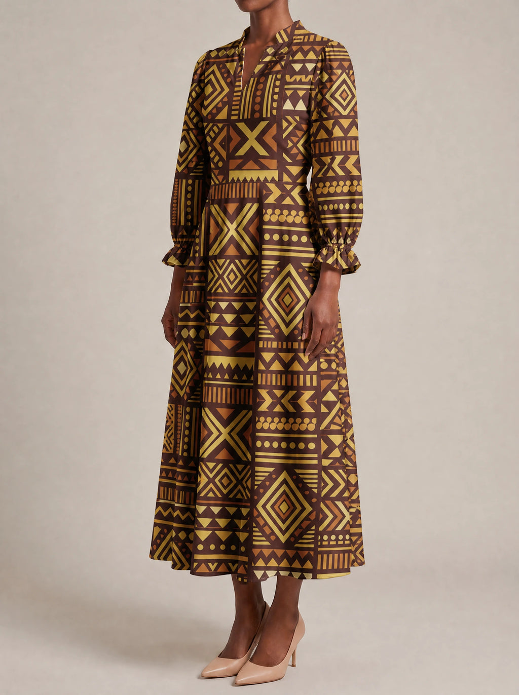 "Mudcloth" Long Puff Sleeve Dress — three-quarter view on model