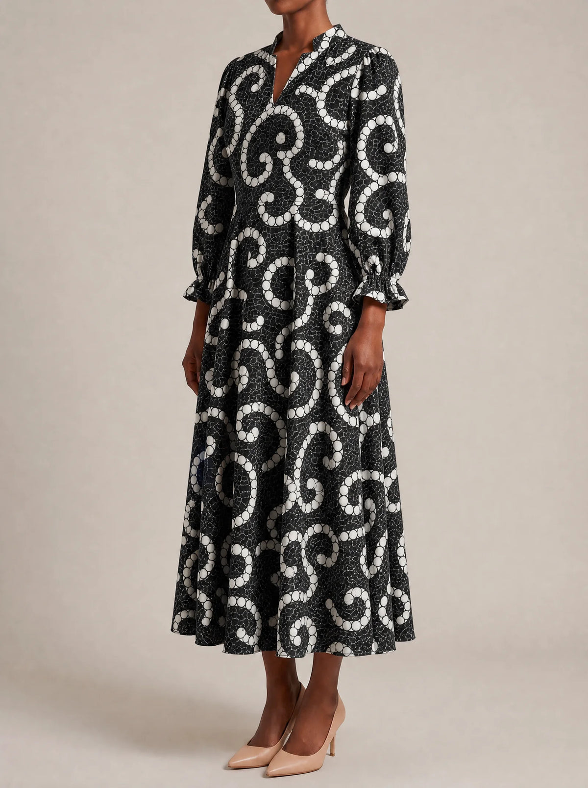 "Duara" Long Puff Sleeve Dress — three-quarter view on model