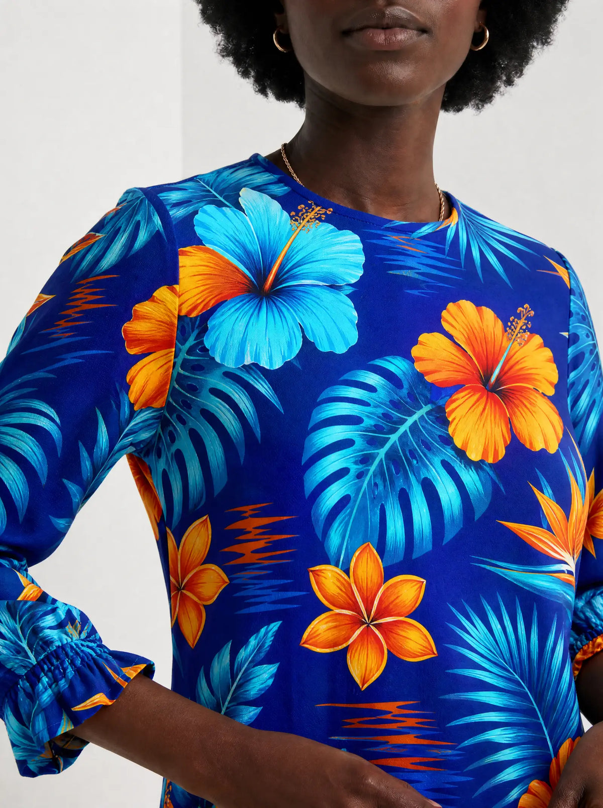 "Maua" Long Sleeve Maxi Dress — three-quarter view on model