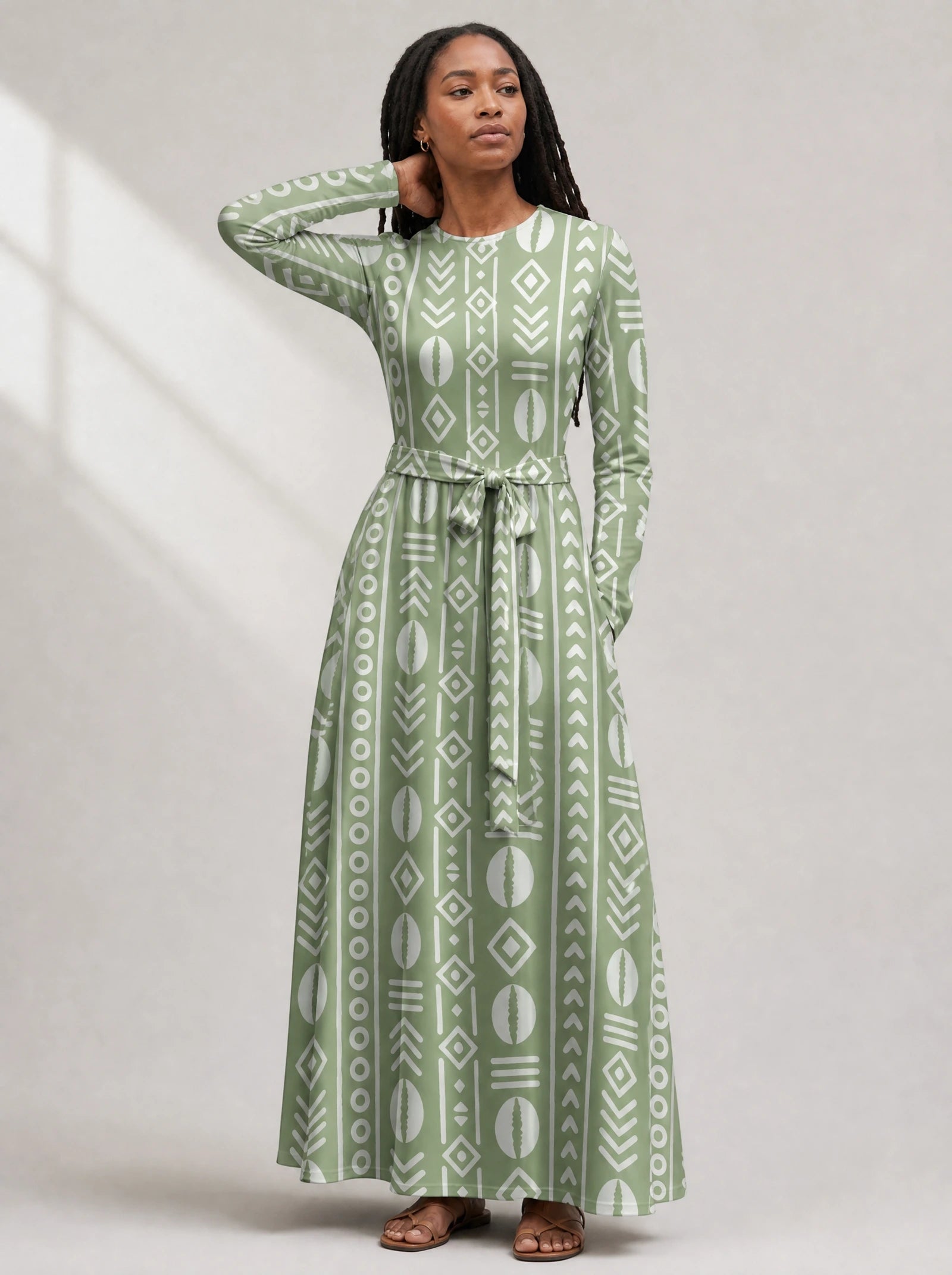 "Oshun Verde" Viscose Midi Dress — close-up of the round neckline and long sleeve