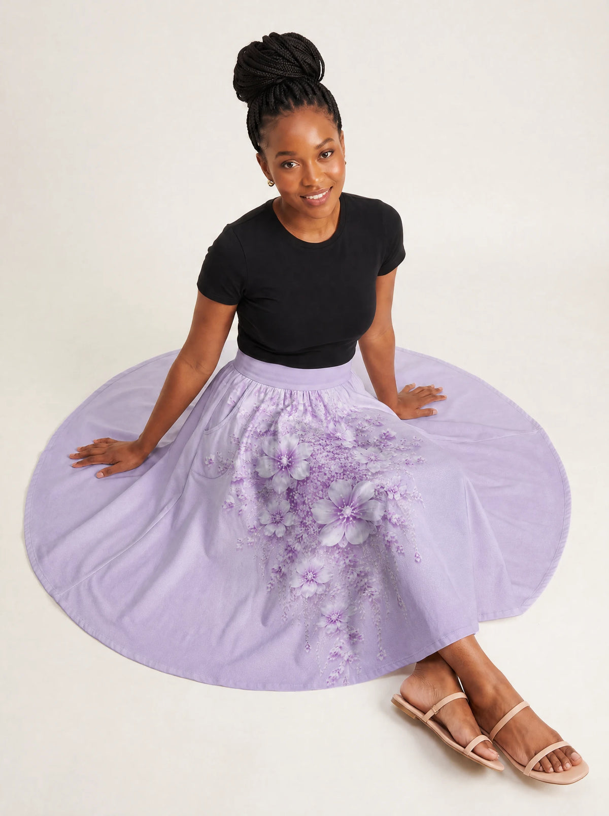 "Zambarau" Twirl Skirt — seated on model