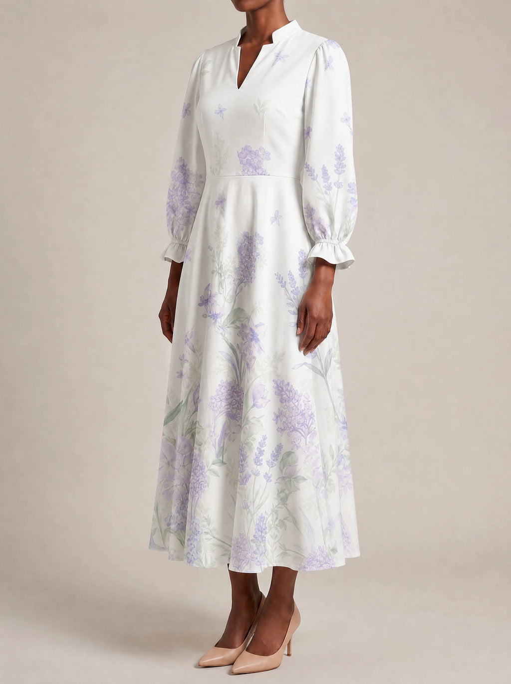 "Urujuani" Long Puff Sleeve Dress — three-quarter view on model