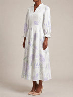 "Urujuani" Long Puff Sleeve Dress — three-quarter view on model