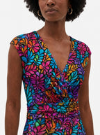 "Rangi" Cap Sleeve Midi Dress — close-up of the V-neckline and cap sleeve