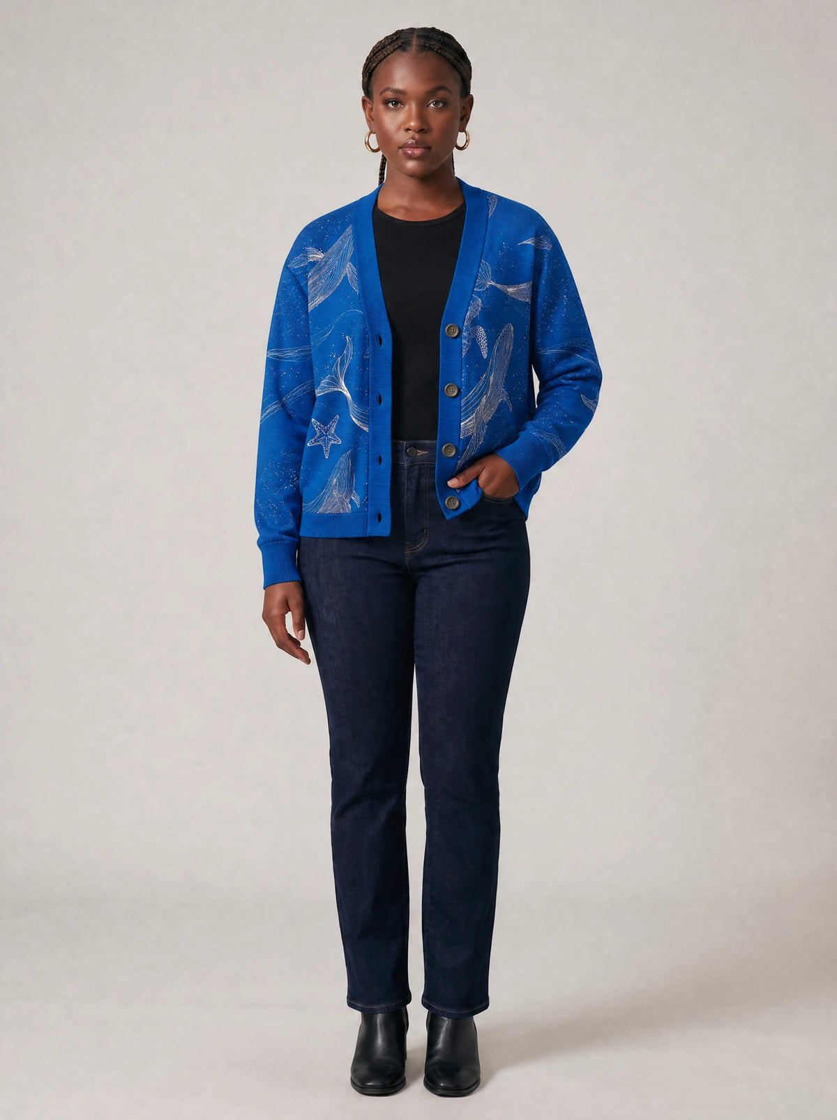 "Pwani" Cardigan — on model with hands in her jeans pockets