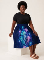 "Bahari" Twirl Skirt — seated on a studio cube