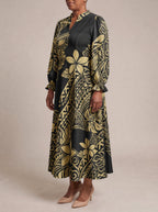 "Pualani" Long Puff Sleeve Dress — three-quarter view on model
