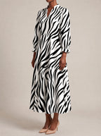 "Milia" Long Puff Sleeve Dress — three-quarter view on model