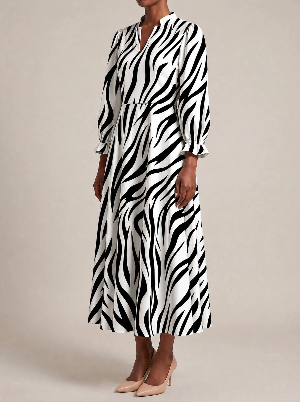 "Milia" Long Puff Sleeve Dress — three-quarter view on model