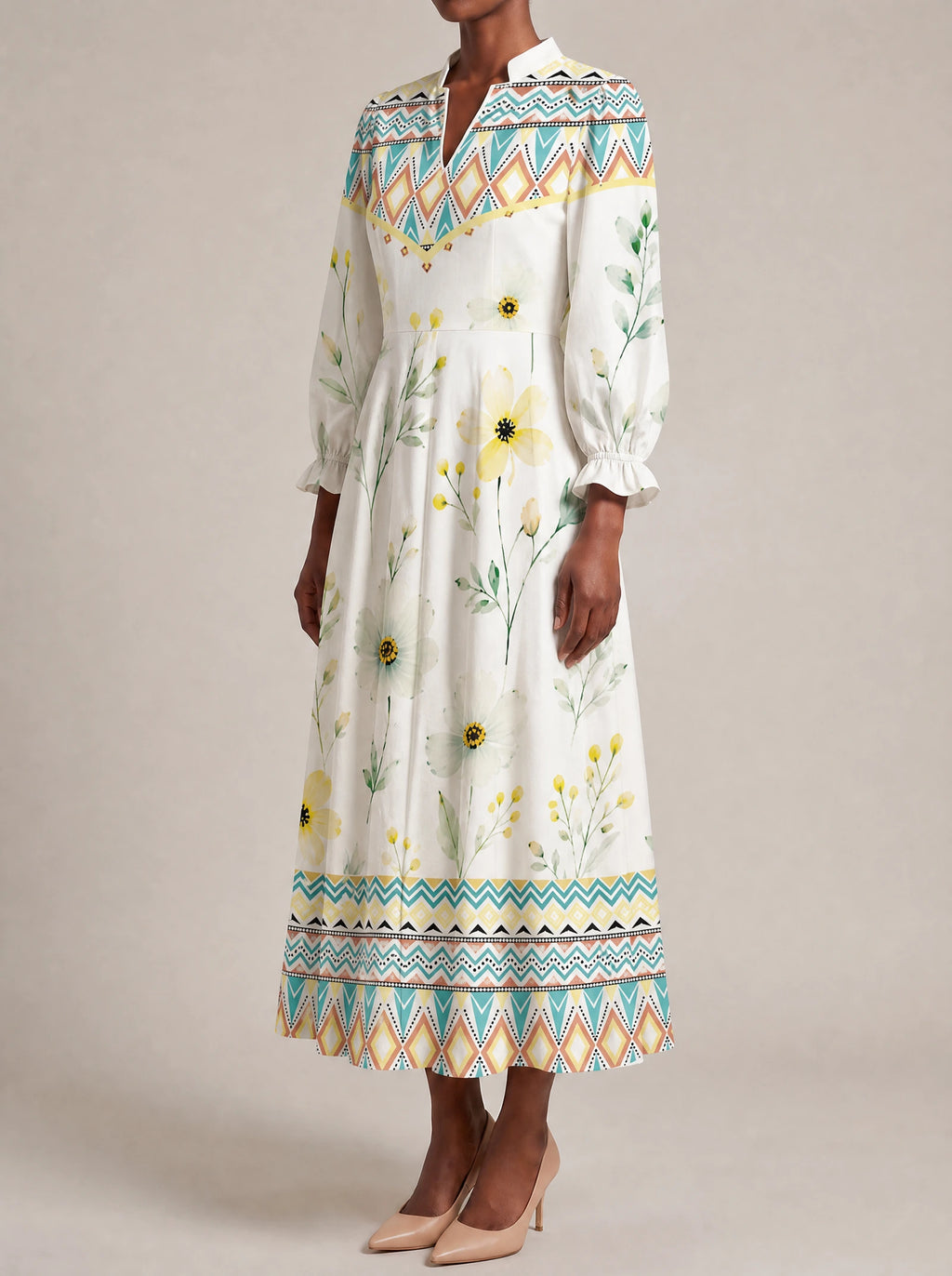 "Alizeti" Long Puff Sleeve Dress — three-quarter view on model