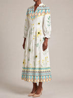 "Alizeti" Long Puff Sleeve Dress — three-quarter view on model