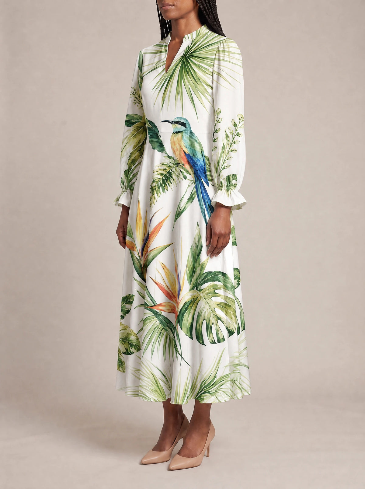 "Ndege" Long Puff Sleeve Dress — three-quarter view on model