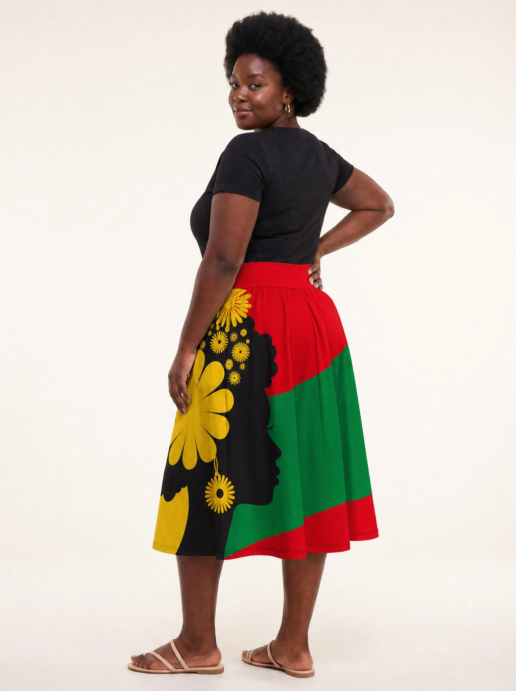 "Furaha" Twirl Skirt — back three-quarter view, looking over shoulder