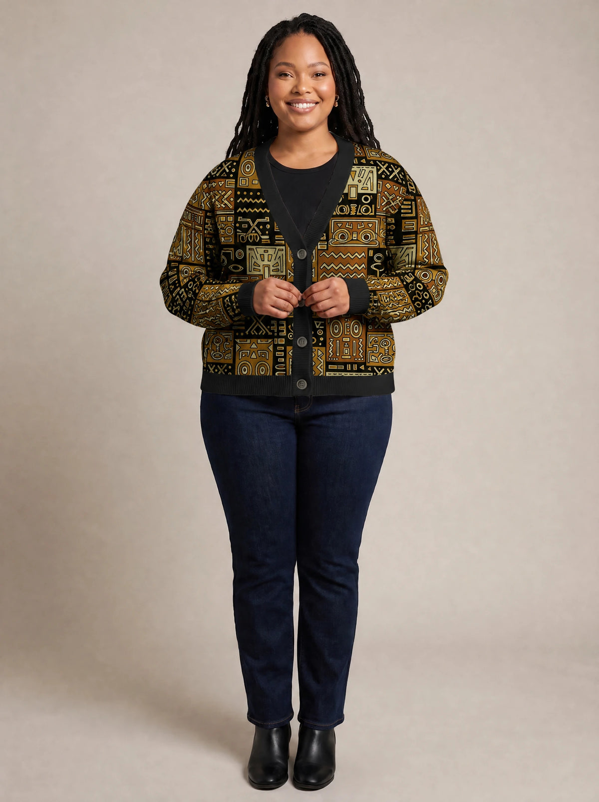 "Sankofa" Knitted Cardigan — on model fastening the buttons