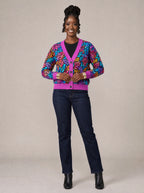 "Rangi" Cardigan — on model fastening the buttons