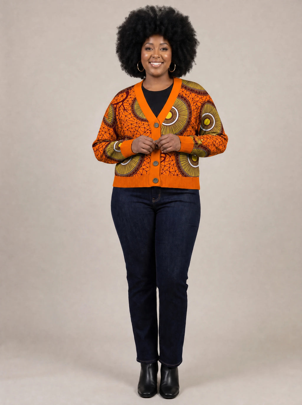 "Mchana" Cardigan — on model fastening the buttons