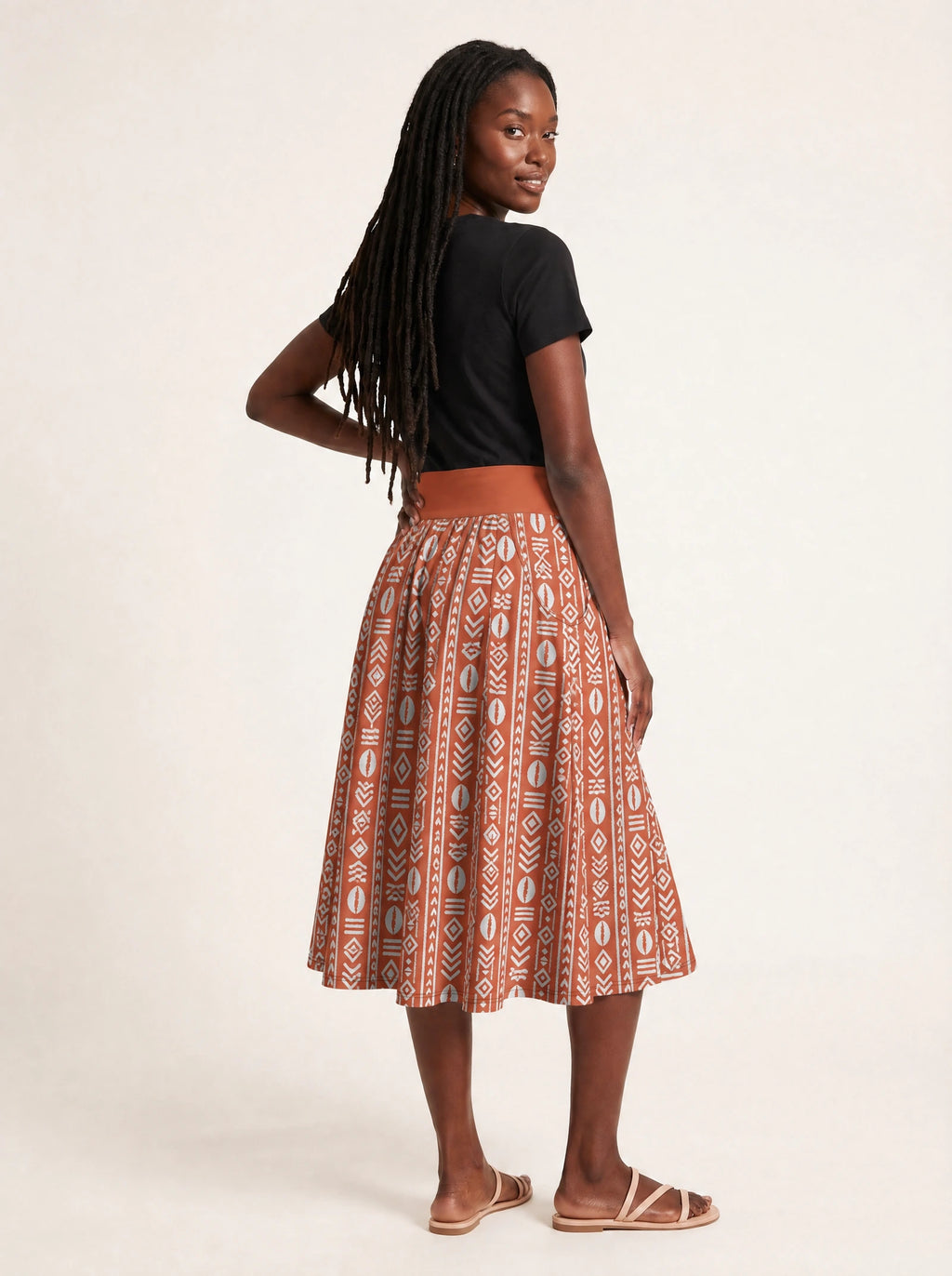 "Oshun Kijani" Twirl Skirt — back three-quarter view, looking over shoulder