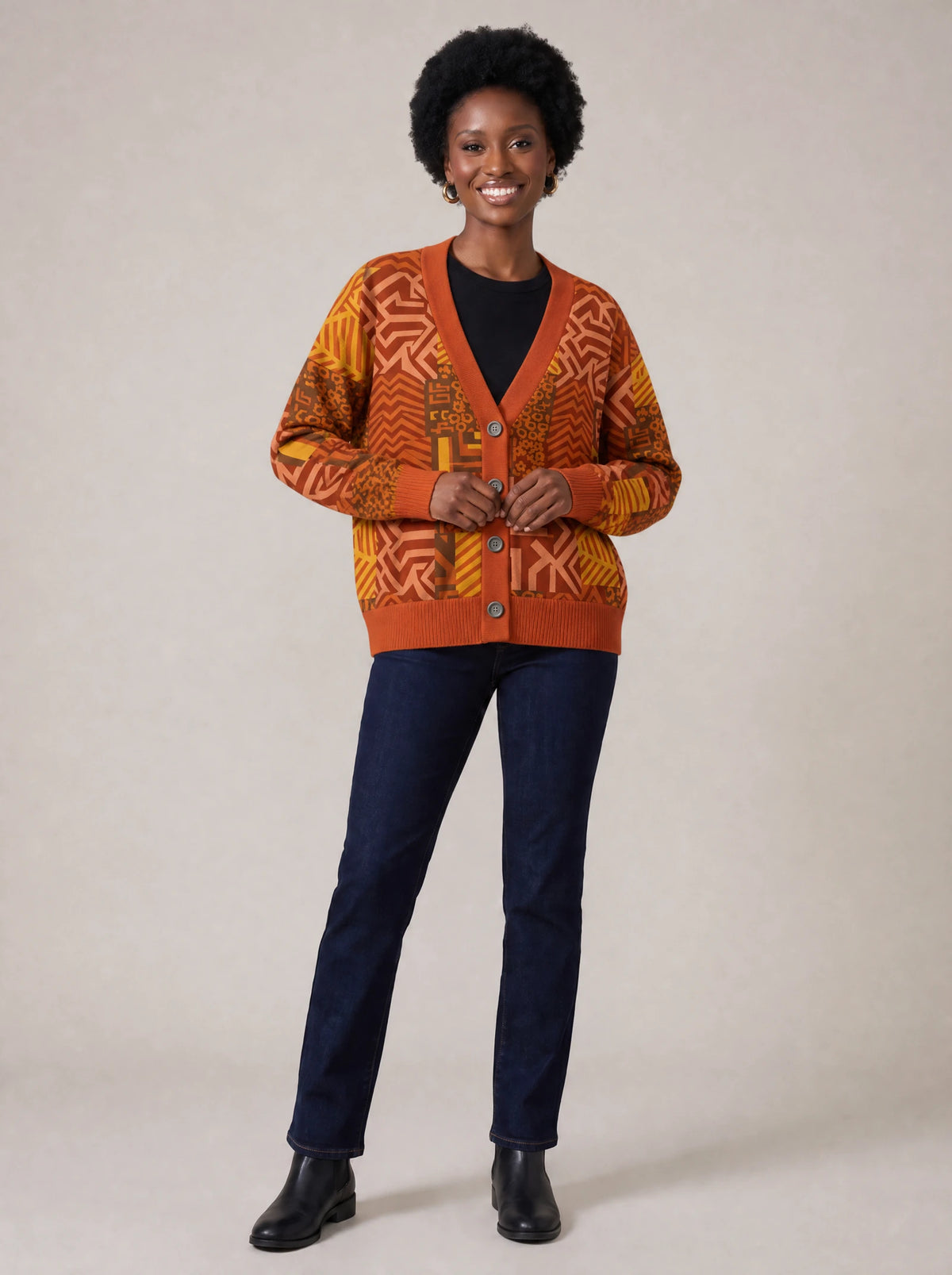 "Viraka" Cardigan — on model fastening the buttons