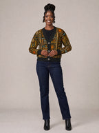 "Afrocentric Pattern" Cardigan — on model fastening the buttons