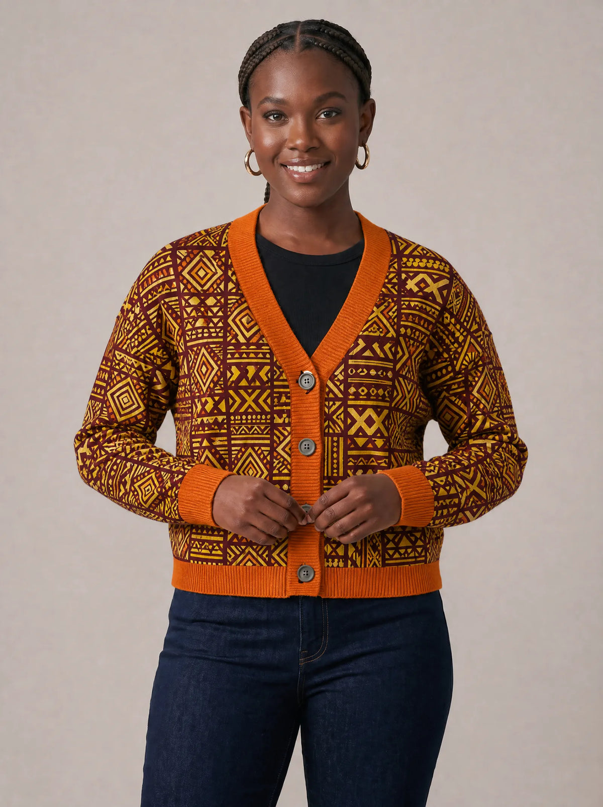 "Mudcloth" Cardigan — on model fastening the buttons