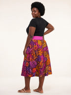 "Waridi" Twirl Skirt — back three-quarter view, looking over shoulder