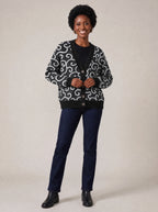 "Duara" Cardigan — on model fastening the buttons