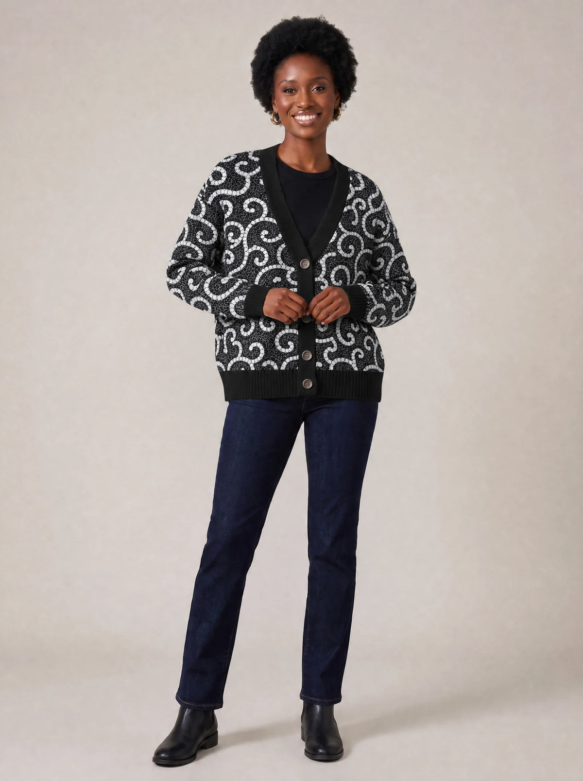 "Duara" Cardigan — on model fastening the buttons