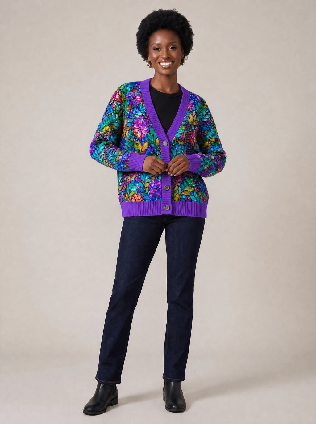 "Upinde" Cardigan — on model fastening the buttons