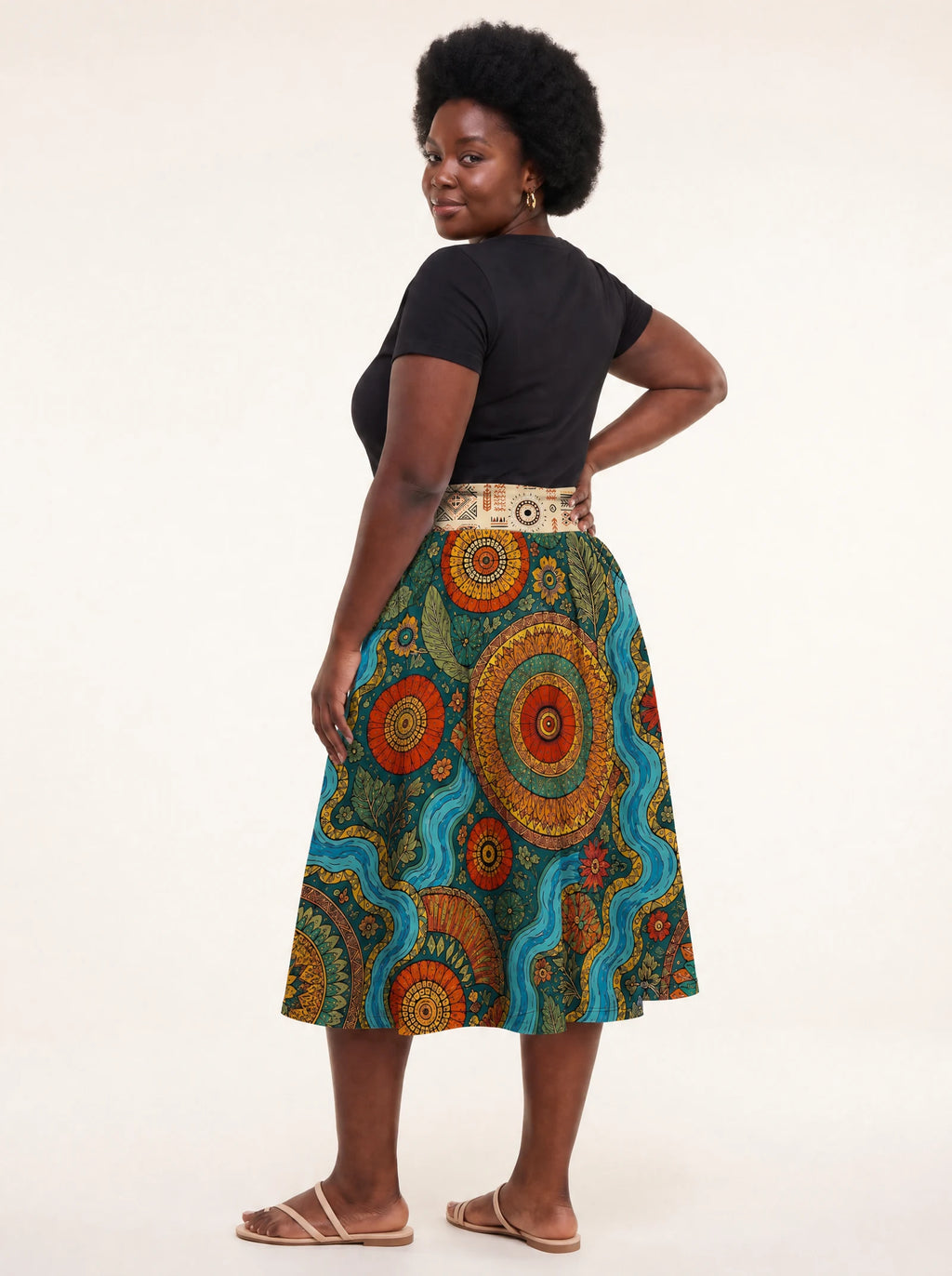 "Mto" Twirl Skirt — back three-quarter view, looking over shoulder