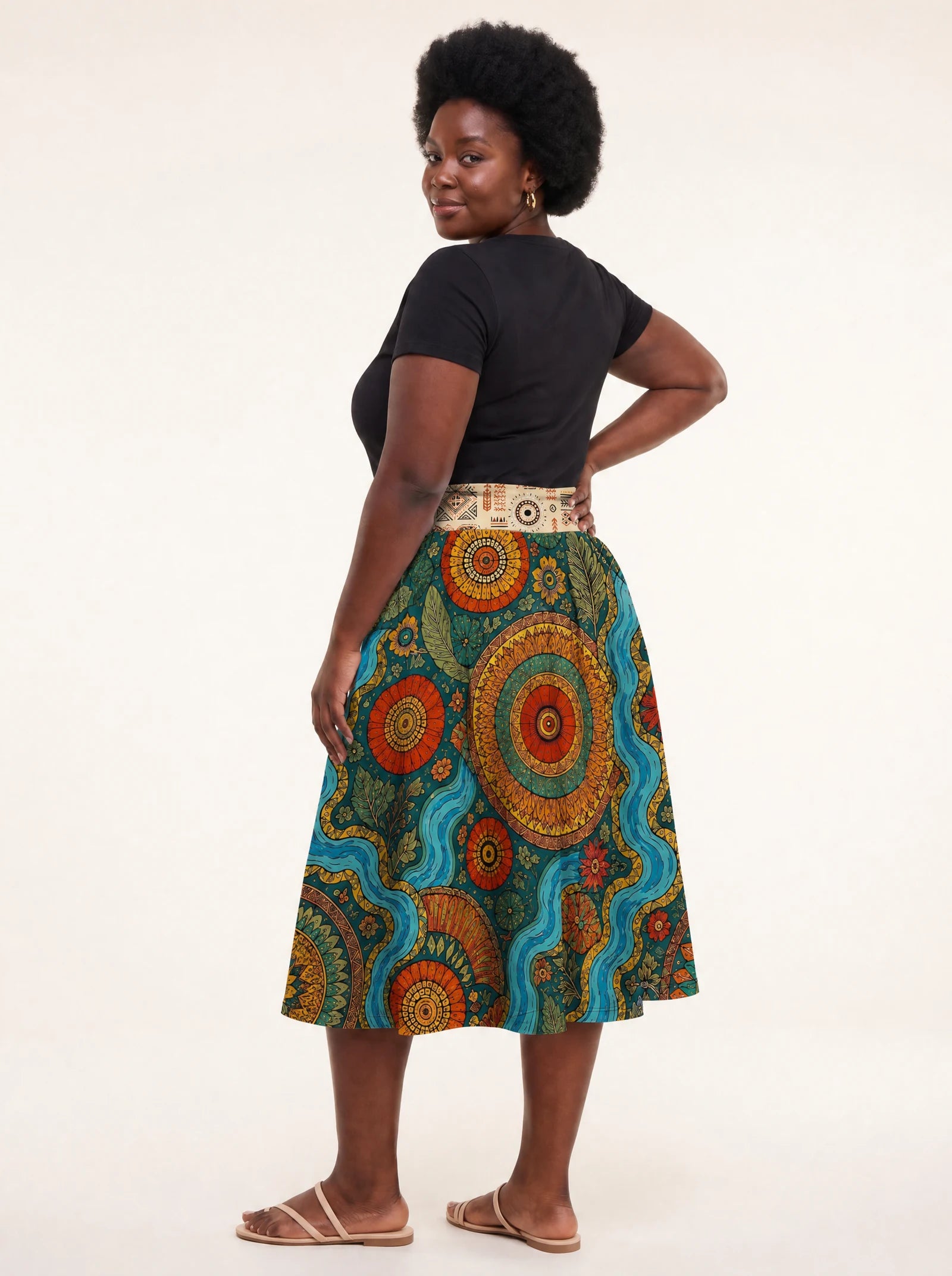 "Mto" Twirl Skirt — back three-quarter view, looking over shoulder