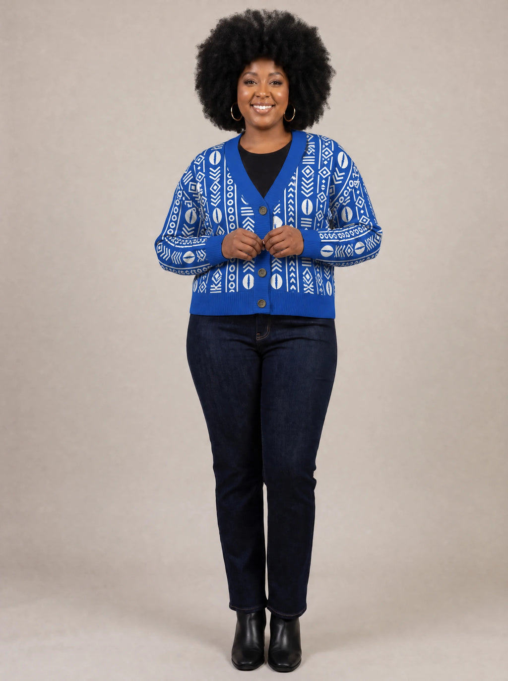 "Oshun Royal Blue" Cardigan — on model fastening the buttons