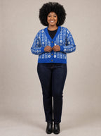"Oshun Royal Blue" Cardigan — on model fastening the buttons