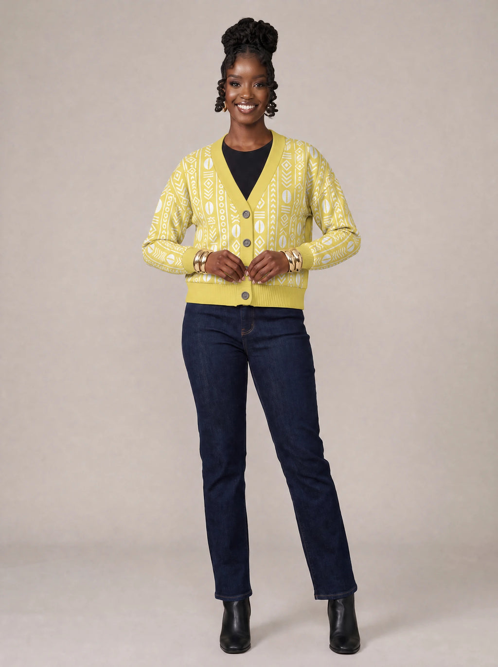 "Oshun Dhahabu" Cardigan — on model fastening the buttons