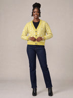"Oshun Dhahabu" Cardigan — on model fastening the buttons