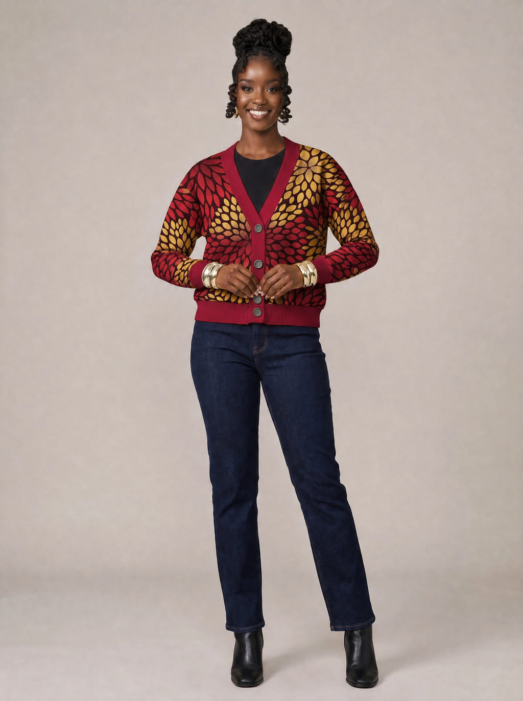 "Mavuno" Cardigan — on model fastening the buttons