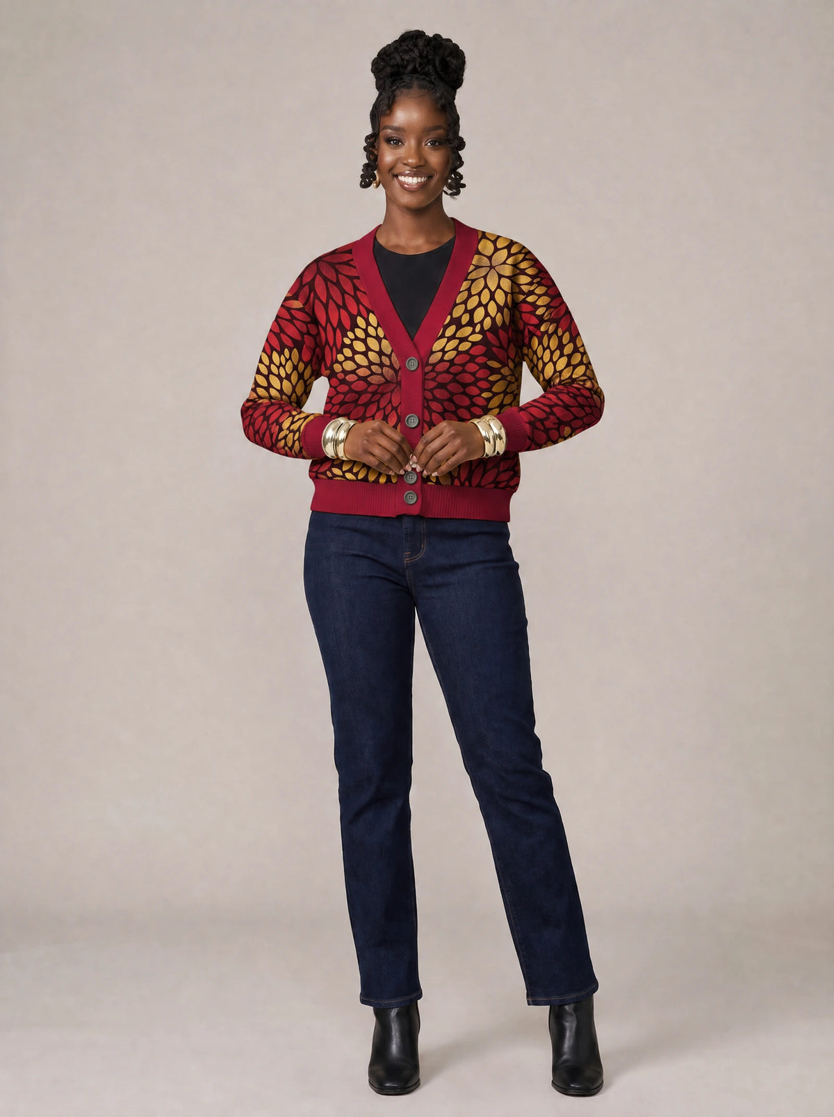 "Mavuno" Cardigan — on model fastening the buttons