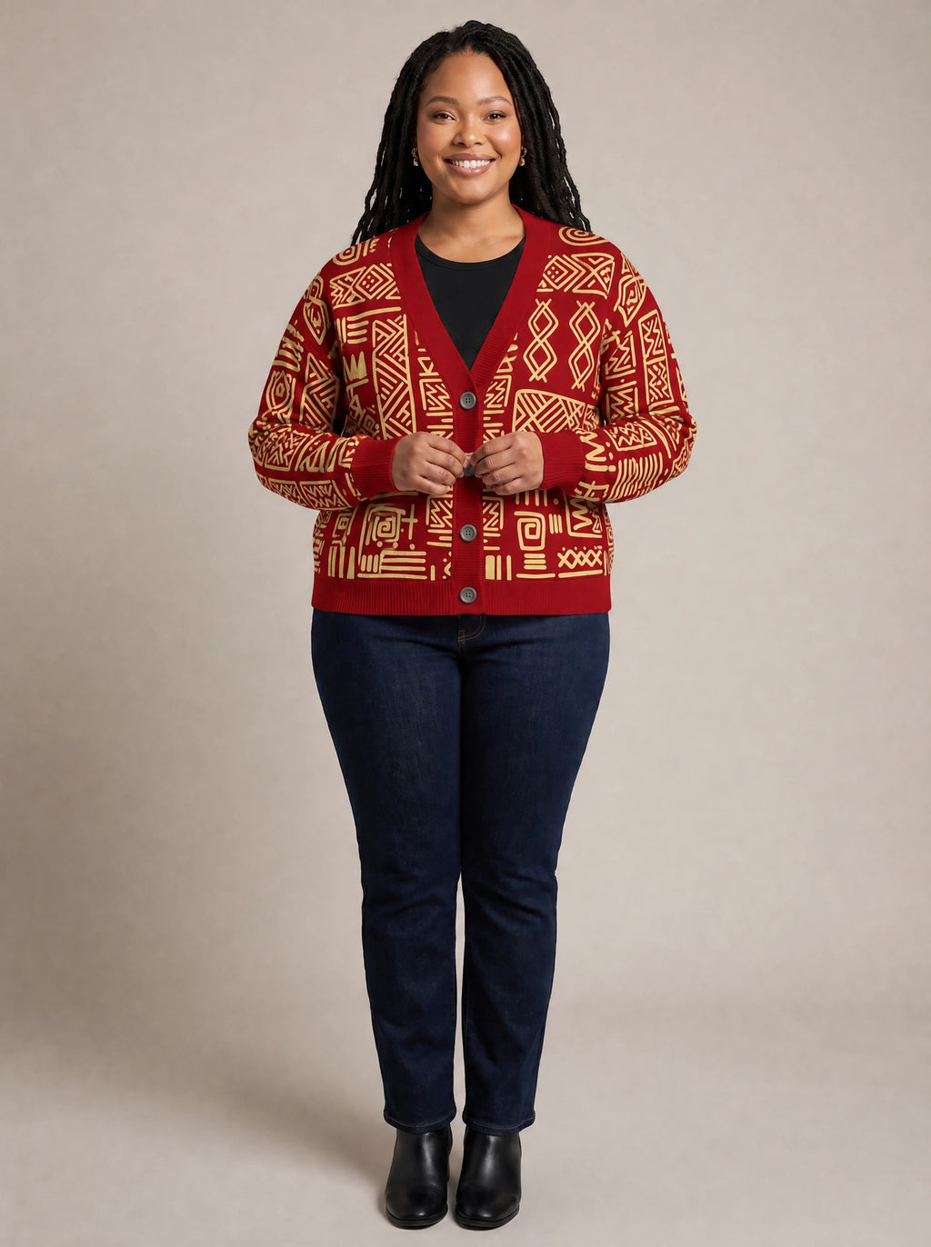 "Alama" Cardigan — on model fastening the buttons