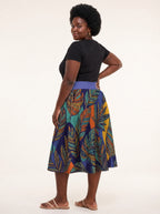 "Majani" Twirl Skirt — back three-quarter view, looking over shoulder