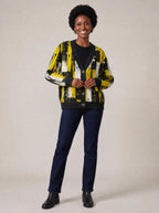 "Mvua" Cardigan — on model fastening the buttons