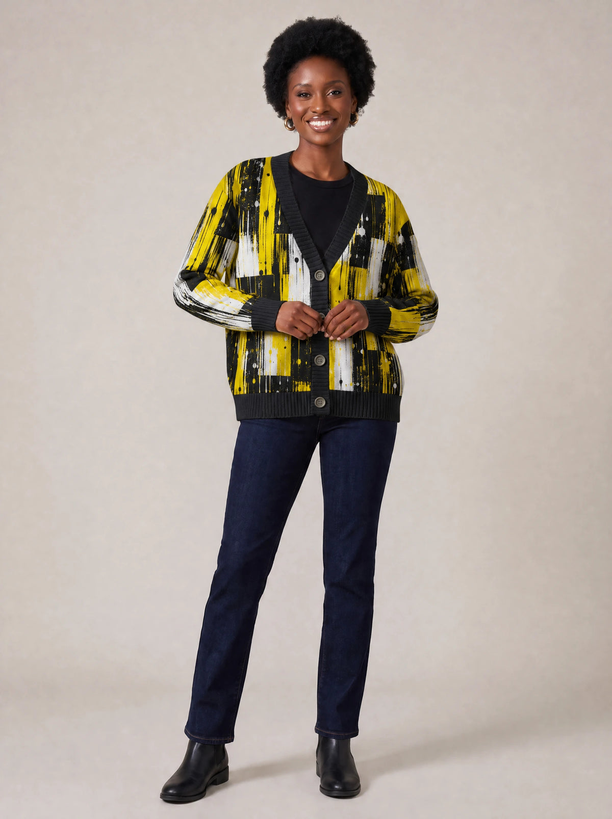 "Mvua" Cardigan — on model fastening the buttons