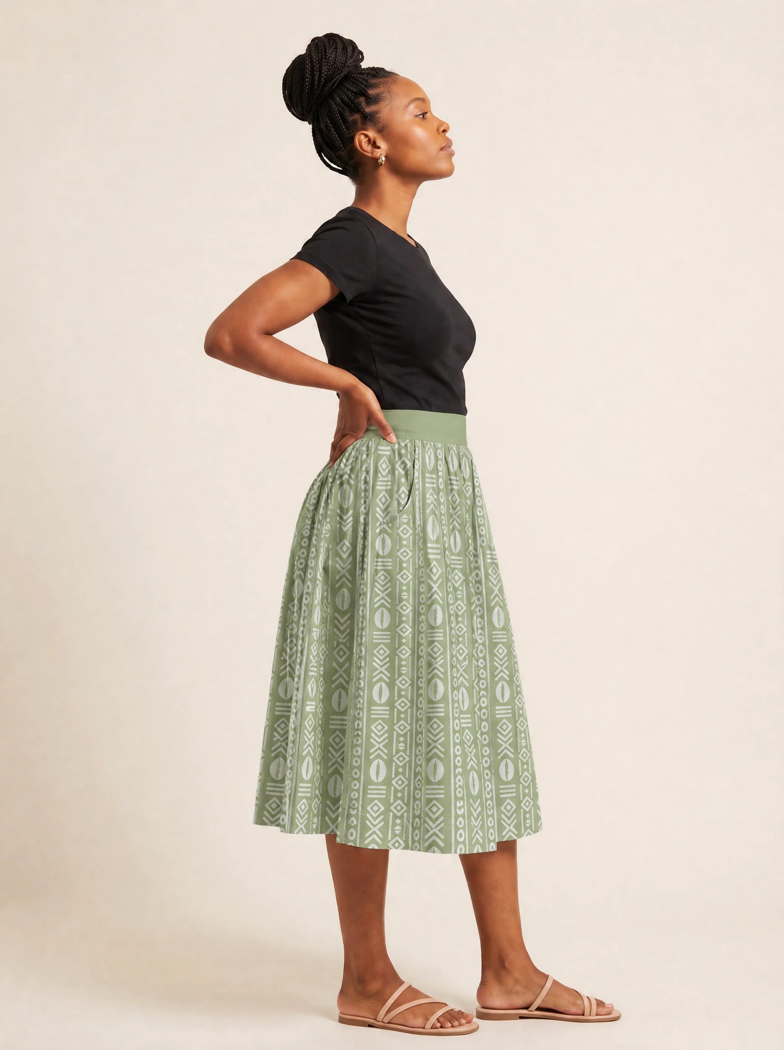 "Oshun Verde" Twirl Skirt — side profile on model