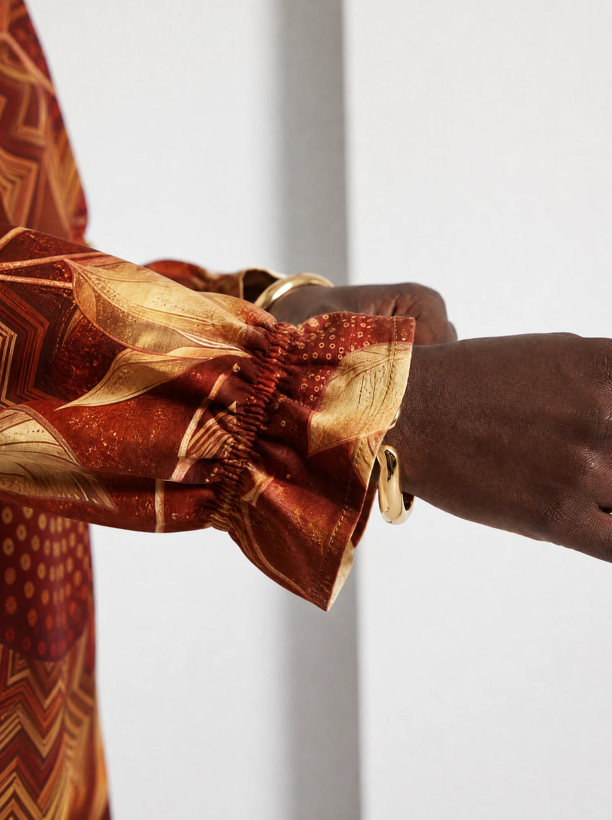 "Joto" Long Sleeve Maxi Dress — close-up of the gathered ruffle cuff at the wrist