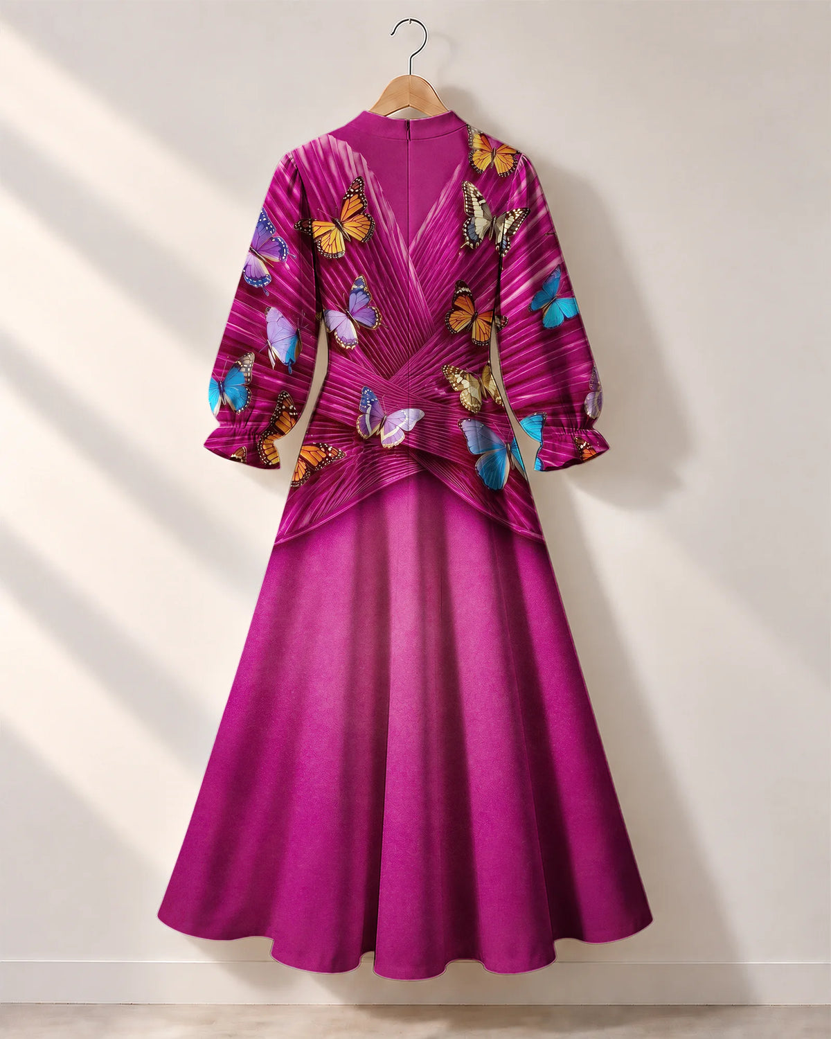 "Kipepeo" Long Puff Sleeve Dress — the dress on a hanger, back