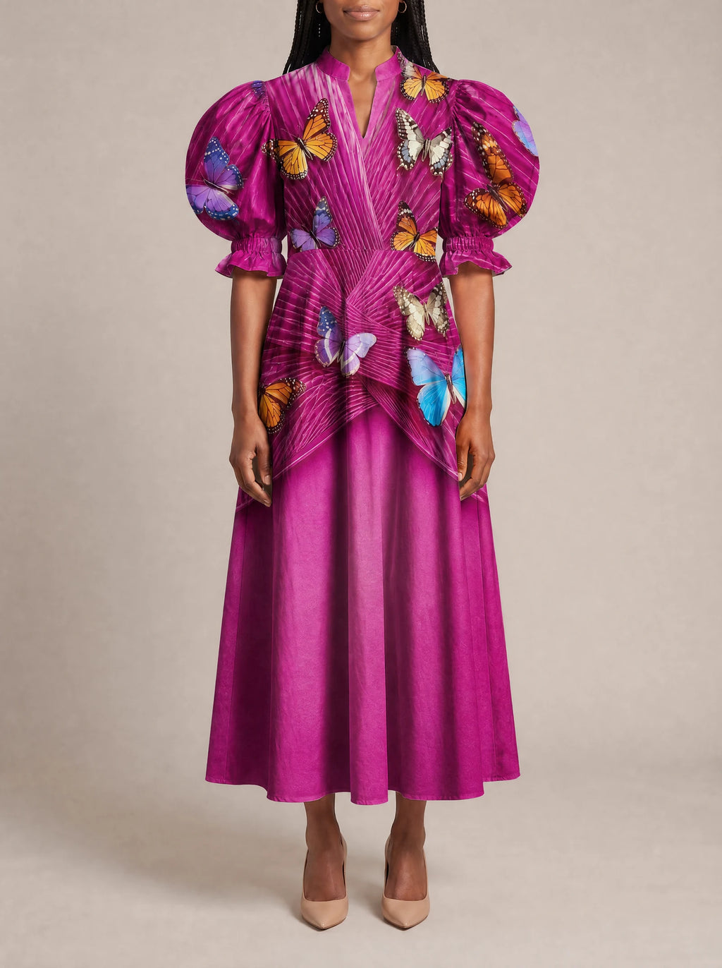 "Kipepeo" Puff Sleeve Dress — three-quarter view on model