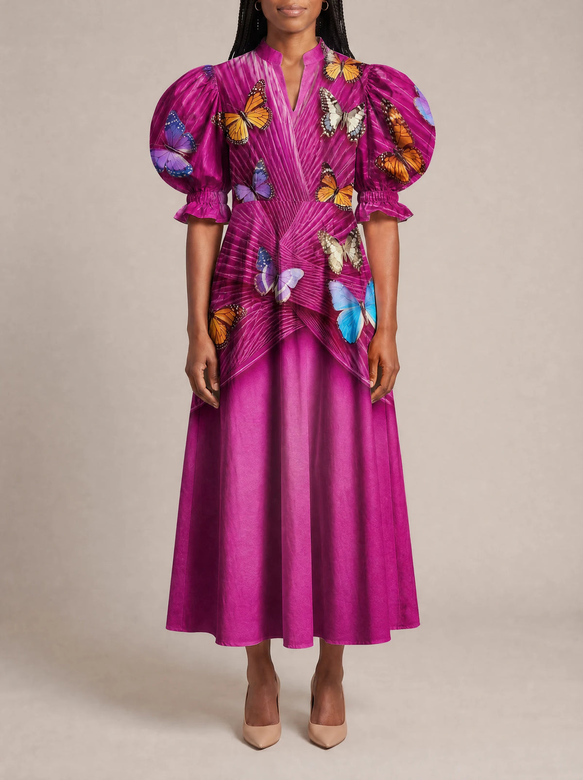 "Kipepeo" Puff Sleeve Dress — three-quarter view on model