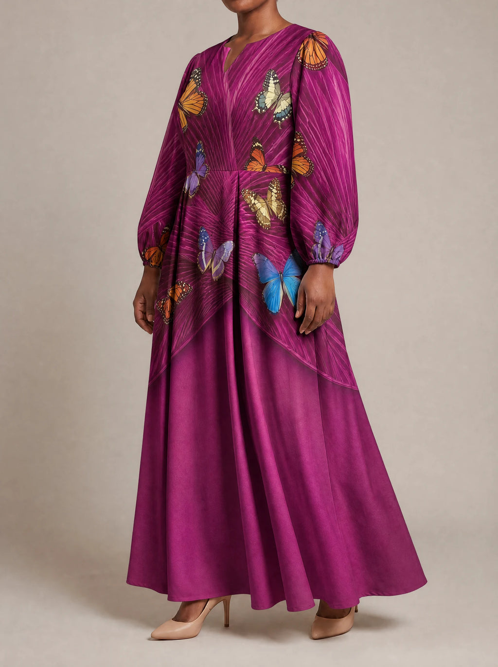 "Kipepeo" Puff Sleeve Maxi Dress — three-quarter view on model
